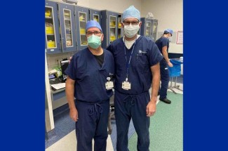 Darren Johnson, M.D (left) and Brian Noehren, PT, Ph.D., (right) worked together in the operating room to collect data for the study. Photo provided by Caitlin Conley, Ph.D.
